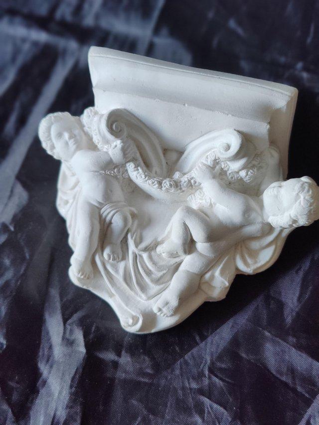 Preview of the first image of Cherub wall bracket or shelf.