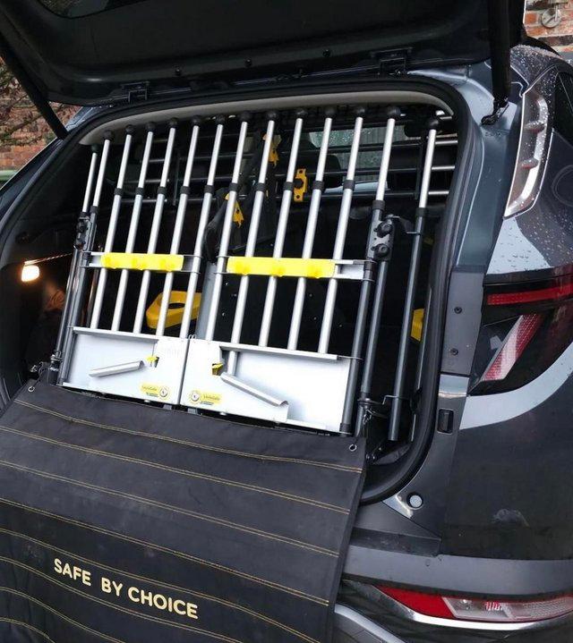 Preview of the first image of Dog Car Guard/Dog Crate - use full boot space.