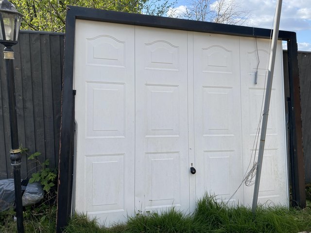 Preview of the first image of Garage door with wooden frame.