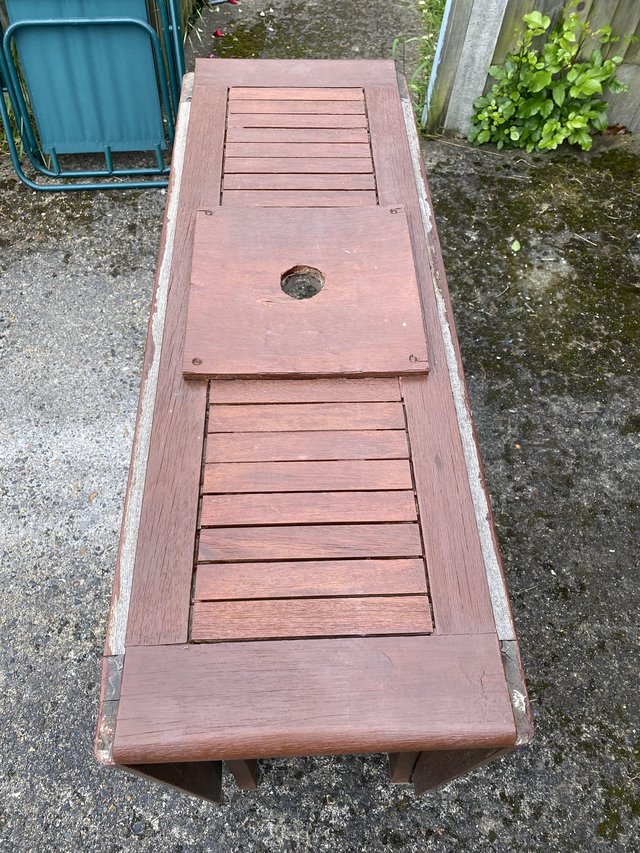 Preview of the first image of Solid wood folding garden table for six people..