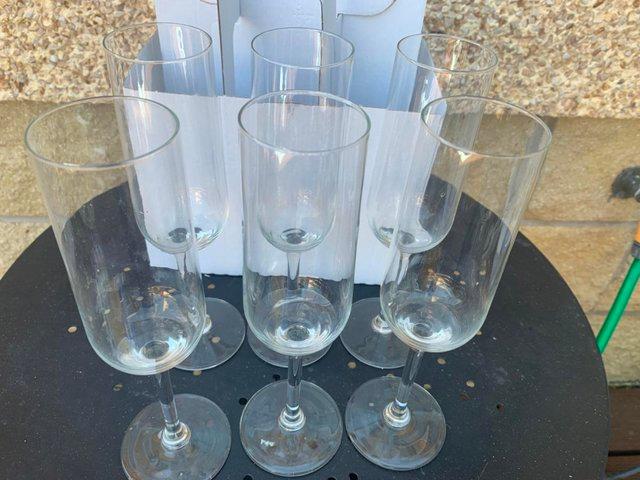Preview of the first image of 6 ikea  glass flute glasses , in box.