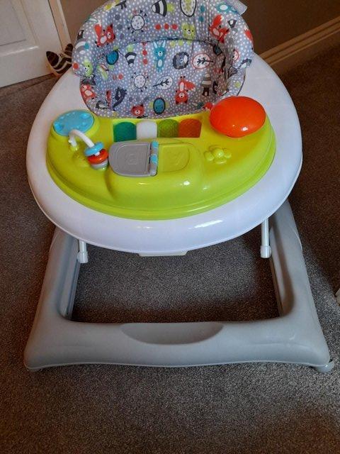 Preview of the first image of BABY WALKER VERY GOOD CONDITION HARDLY USED.