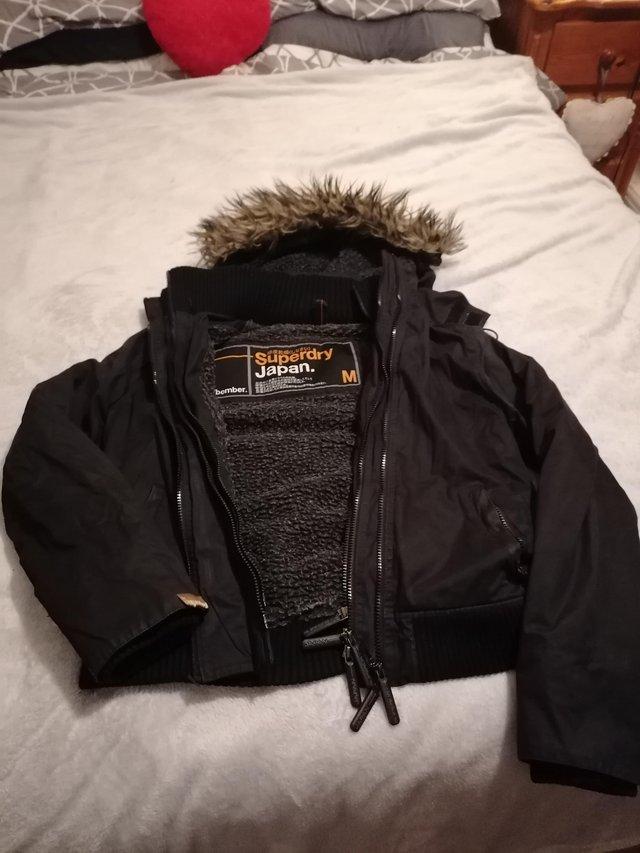 Preview of the first image of Ladies SUPERDRY WINDBOMBER in black.