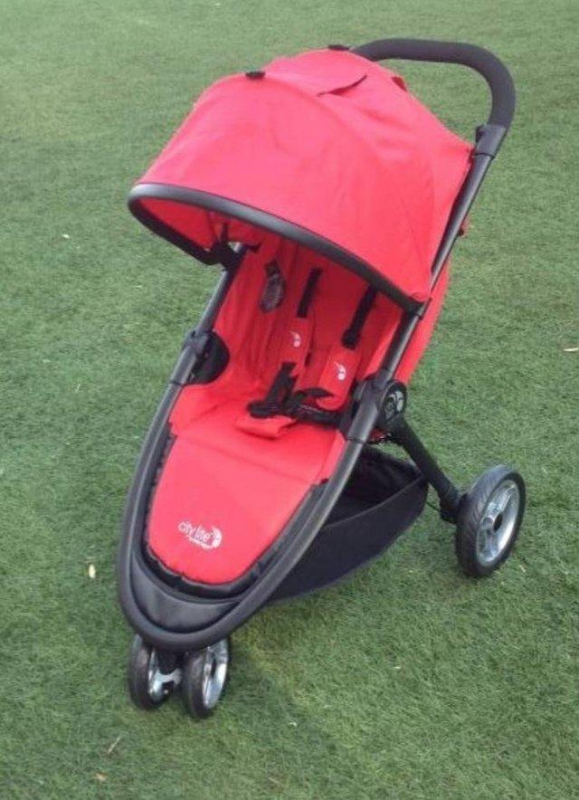 Preview of the first image of Baby jogger red and black pushchair.