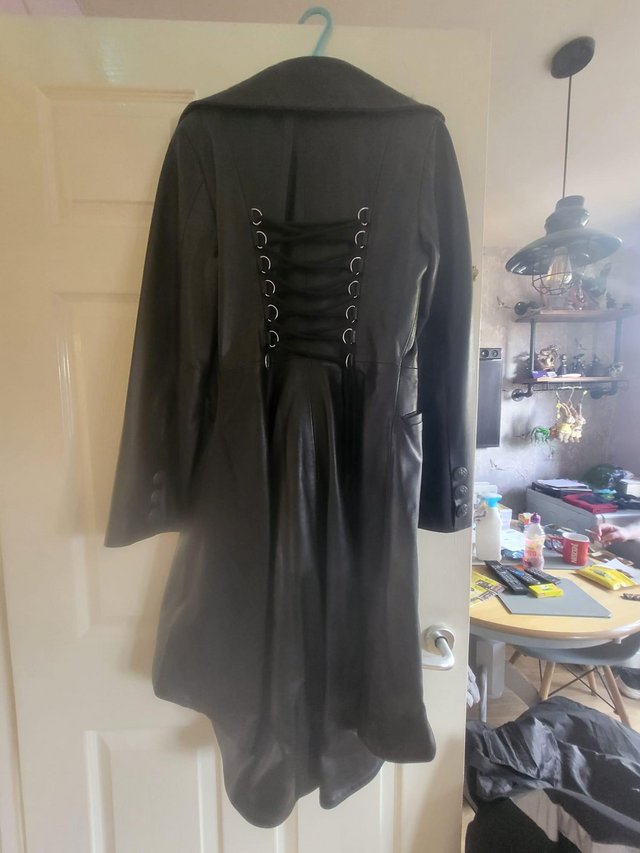 Preview of the first image of New with tags a hand crafted leather goth jacket.