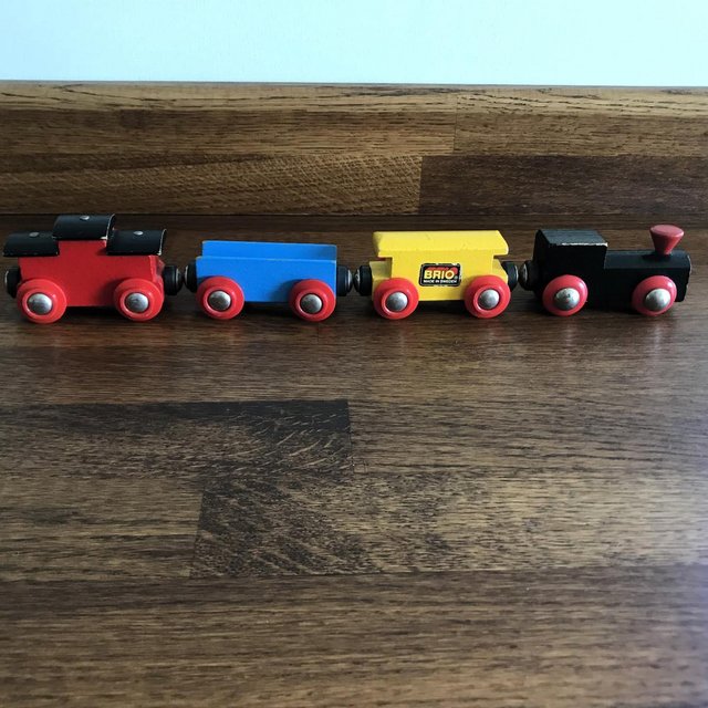 Preview of the first image of Vintage 1990's wooden BRIO engine + 2 trucks & caboose.