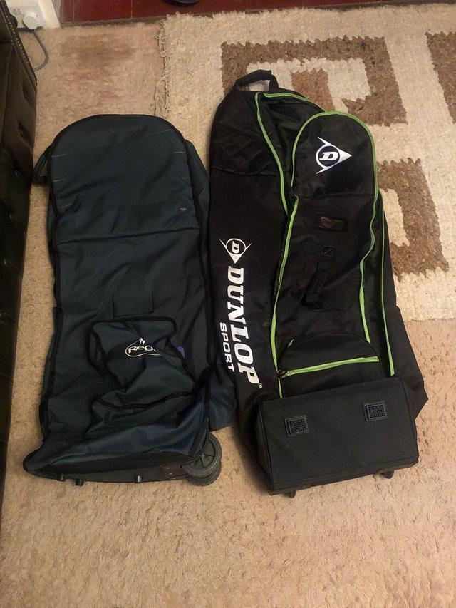 Preview of the first image of Two wheeling golf bags for travel.