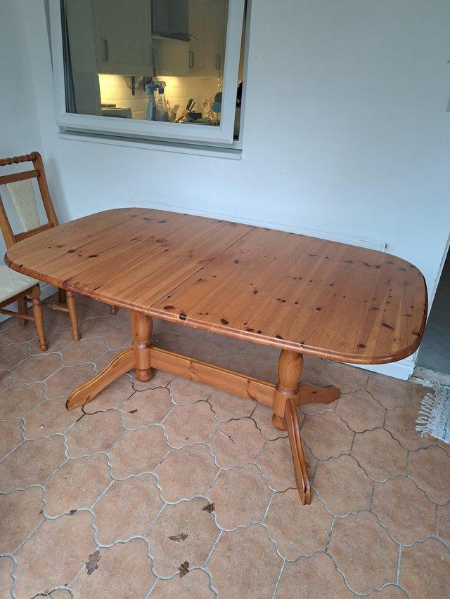 Preview of the first image of Pine dining table with 6 chairs.