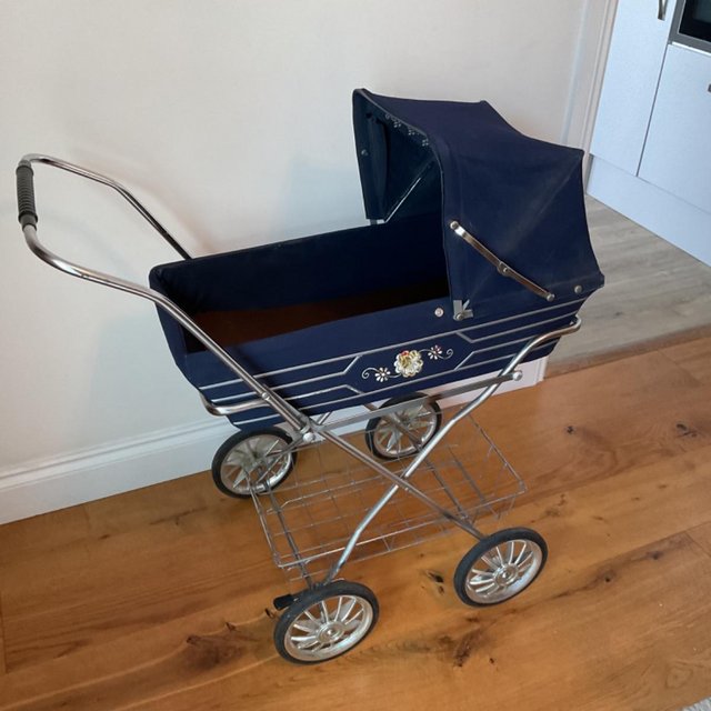 Preview of the first image of VINTAGE TOY DOLL’S PRAM FROM EARLY 1980’S.