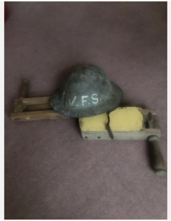 Image 2 of soldiers tin helmets 1st or 2nd war ? Wooden gas rattles ?