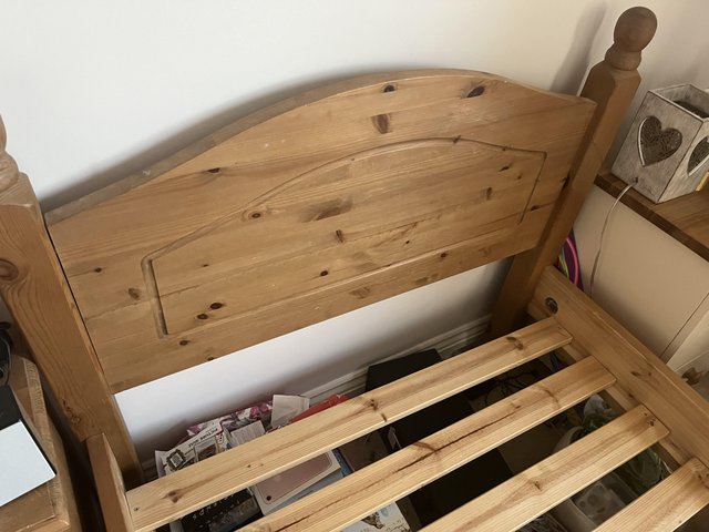 Preview of the first image of Pine single bed with carved acorn features.