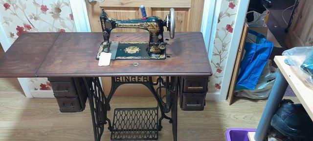 Image 1 of 1898 Singer 27K sewing machine and treadle table.