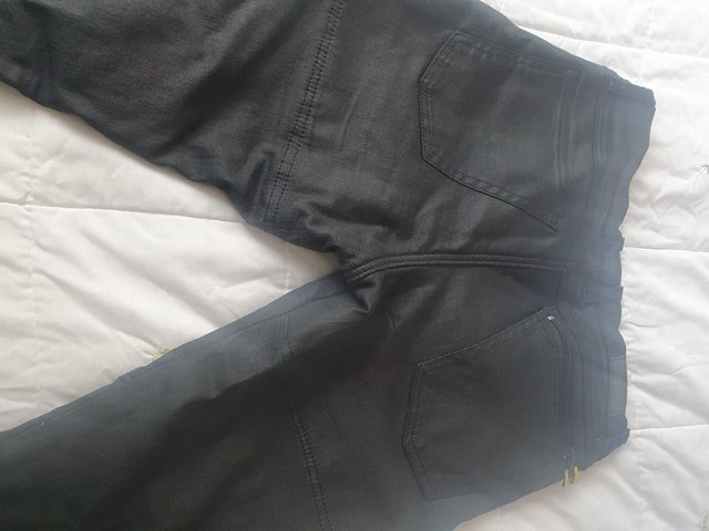 Preview of the first image of MOTORCYCLE BOOTS AND TROUSERS.