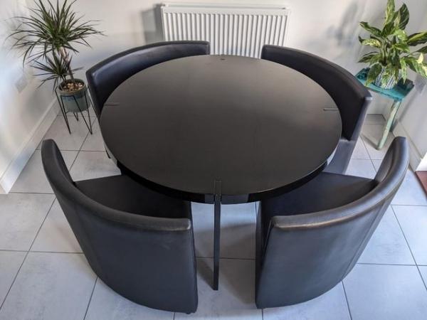 Image 2 of Round black dining table and four space saving chairs
