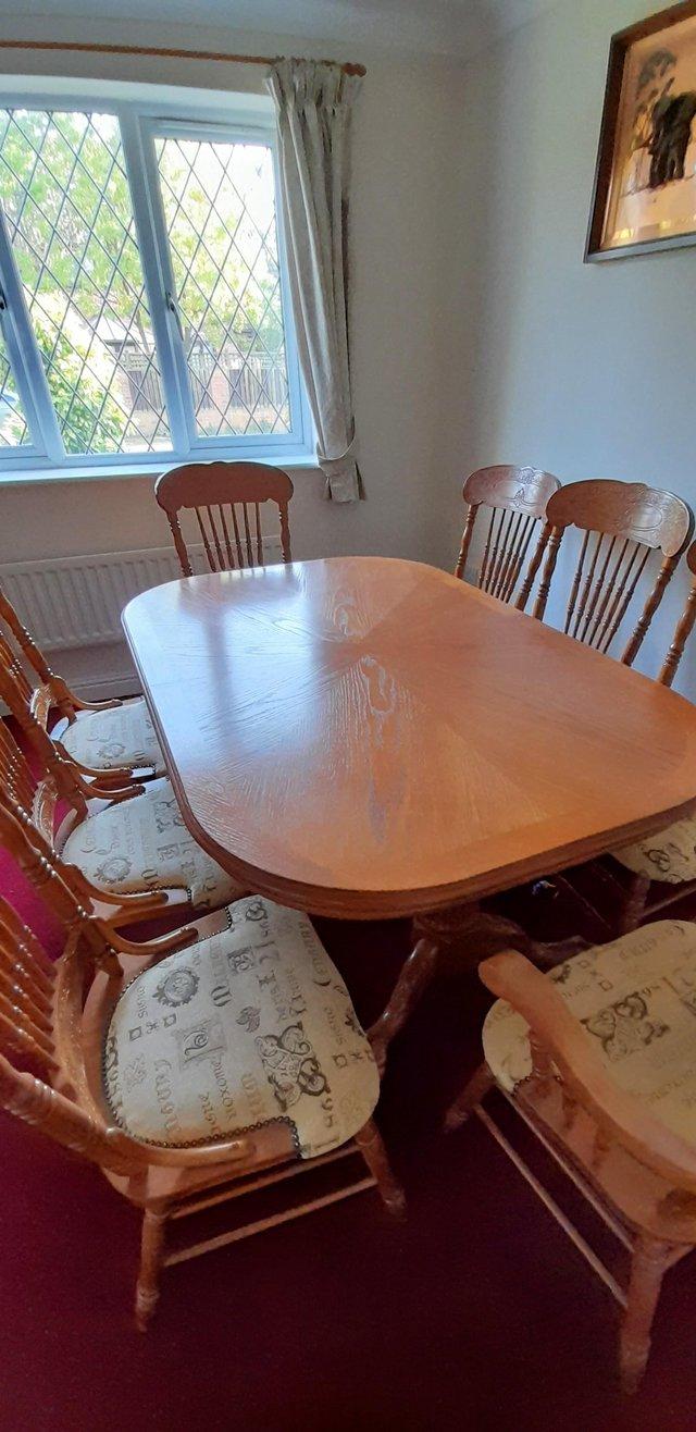 Preview of the first image of High quality dining room table with 8 chairs,2 are carvers..