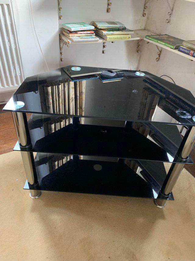 Preview of the first image of Smoked Glass TV stand sold as seen.