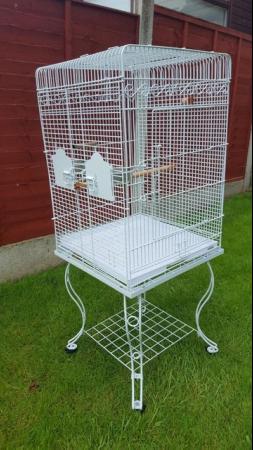 Image 1 of Large bird cage with stand , comes with perches , feeders