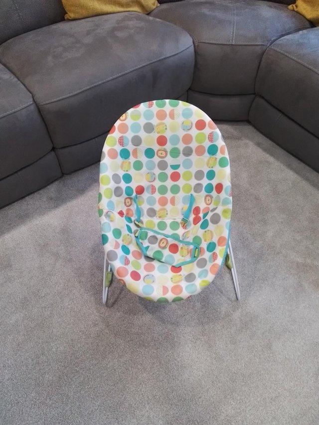 Preview of the first image of Baby bouncy chair lovely condition washable cover.