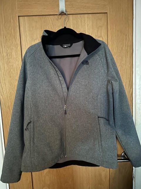 Preview of the first image of Grey waterproof coat with micro fleece lining.