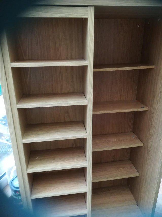 Preview of the first image of STORAGE CABINET . LIGHT OAK EFFECT FINISH.