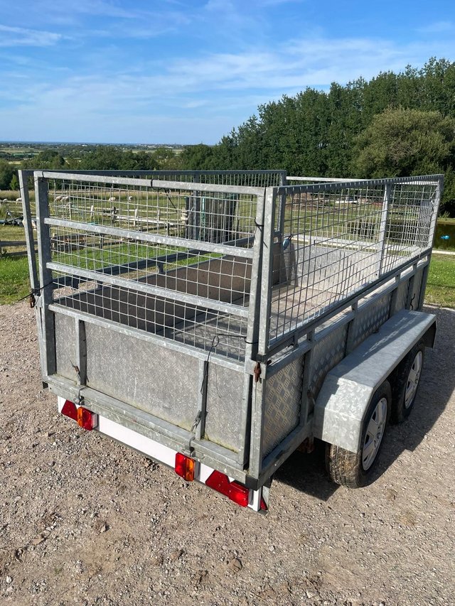 Preview of the first image of Solid Twin wheeled galvanised meshed trailer.