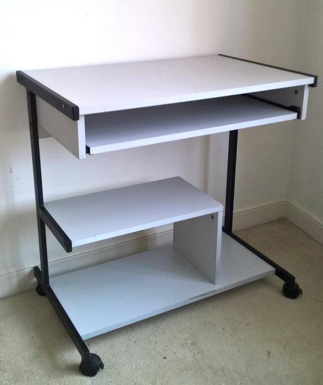 Computer desk on casters with black trim - in perfect condit