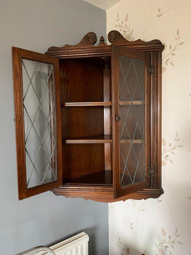 Preview of the first image of Old Charm antique corner cabinet.