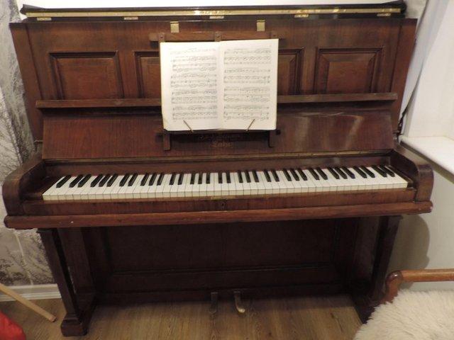 Preview of the first image of Hopkinson Mahogany Framed Antique Upright Piano.