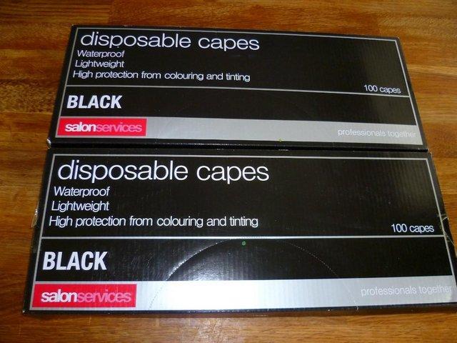 Preview of the first image of 2 Packs Disposable Black Hairdressing Capes,.