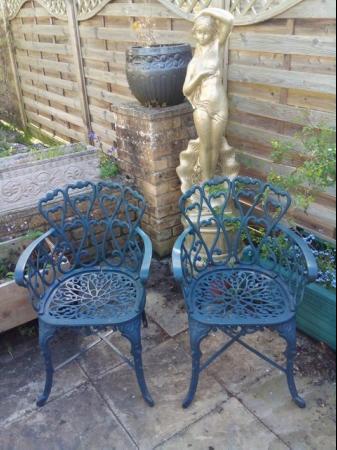 Image 3 of Heavy cast iron garden table with bench and two chairs