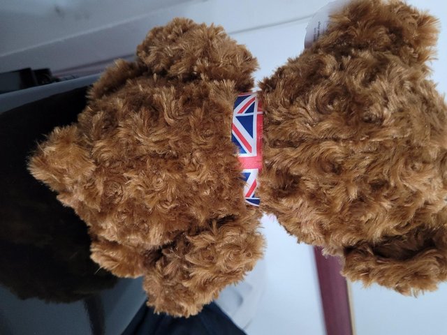 Preview of the first image of WH Smiths 'William' teddy bear with Union Jack neck ribbon.