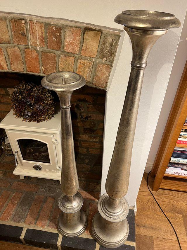 Preview of the first image of 2 Large floor standing candle sticks.