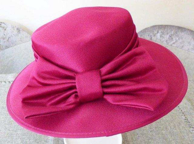 Preview of the first image of BRAND NEW FUCHSIA SILK HAT.