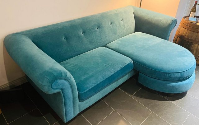 Preview of the first image of DFS Teal Velvet 4-Seater Chaise Sofa.