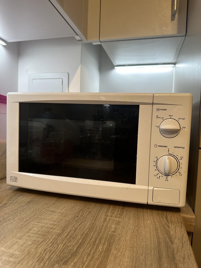 Preview of the first image of Fresh and Perfect Microwave: 1-Year Warranty Remaining!.