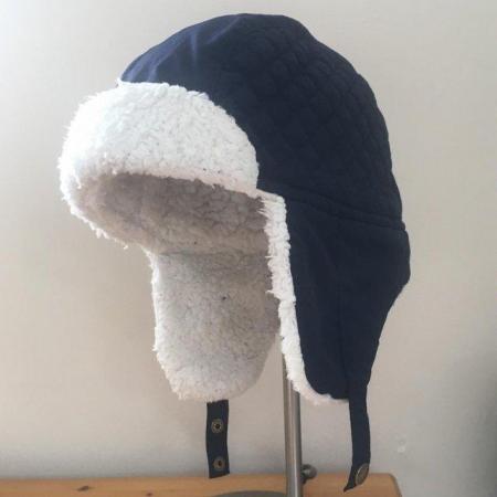 Image 1 of Child's navy ski trapper hat.  Mountain Warehouse.