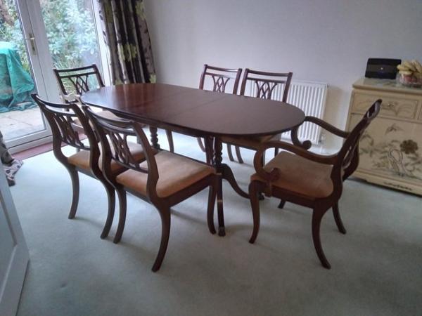 Image 1 of Dining room table and chairs.