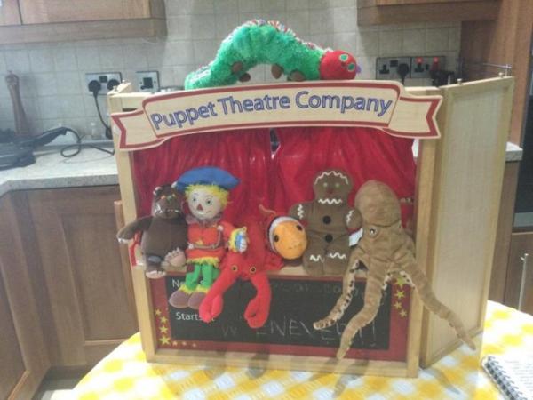 Image 3 of finger puppets in African basket and wooden puppet theatre