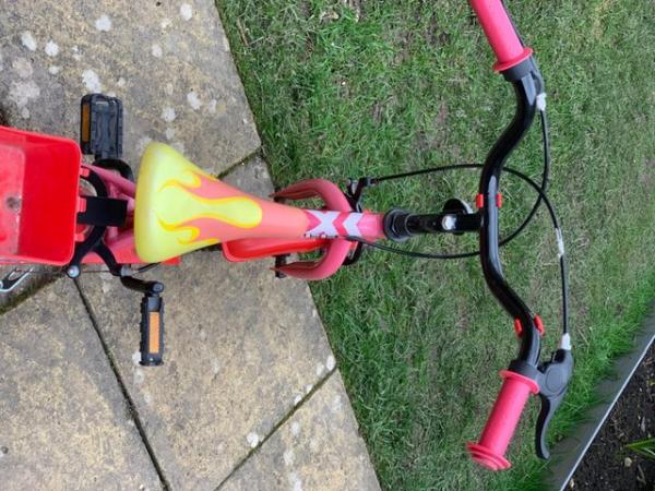 Image 2 of Child’s bike with new stabilisers.