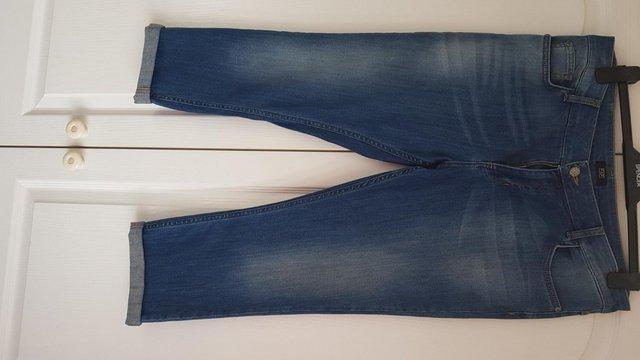 Preview of the first image of F & F Blue Denim cropped jeans.