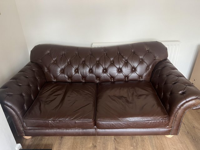 Preview of the first image of Brown leather 3 seater chesterfield.
