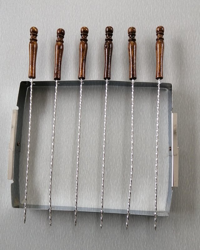 Preview of the first image of A Set of 6 Kebab Skewers with Metal Stand..