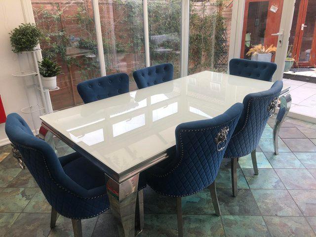 Preview of the first image of beautiful large white glass dining table 6 velvet chairs.