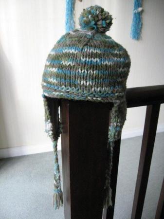 Image 1 of KNITTED LINED HAT WITH EAR FLAPS Blues, Greens, Fawn,White.