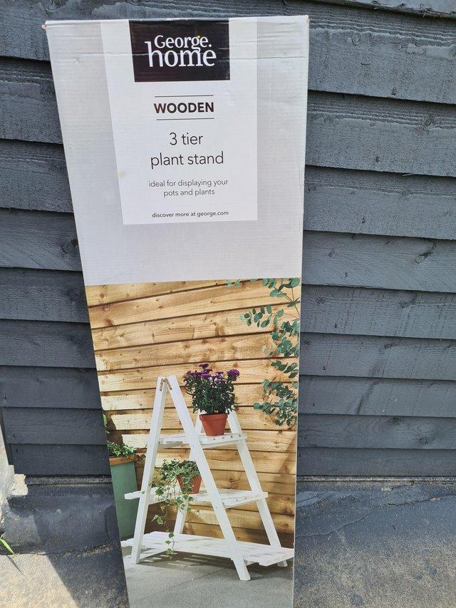 Preview of the first image of 3 TIER WOODEN GARDEN PLANT STAND.