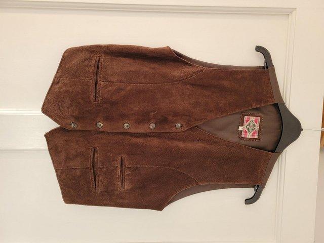 Preview of the first image of Vintage River Island women's brown leather waistcoat, Size S.