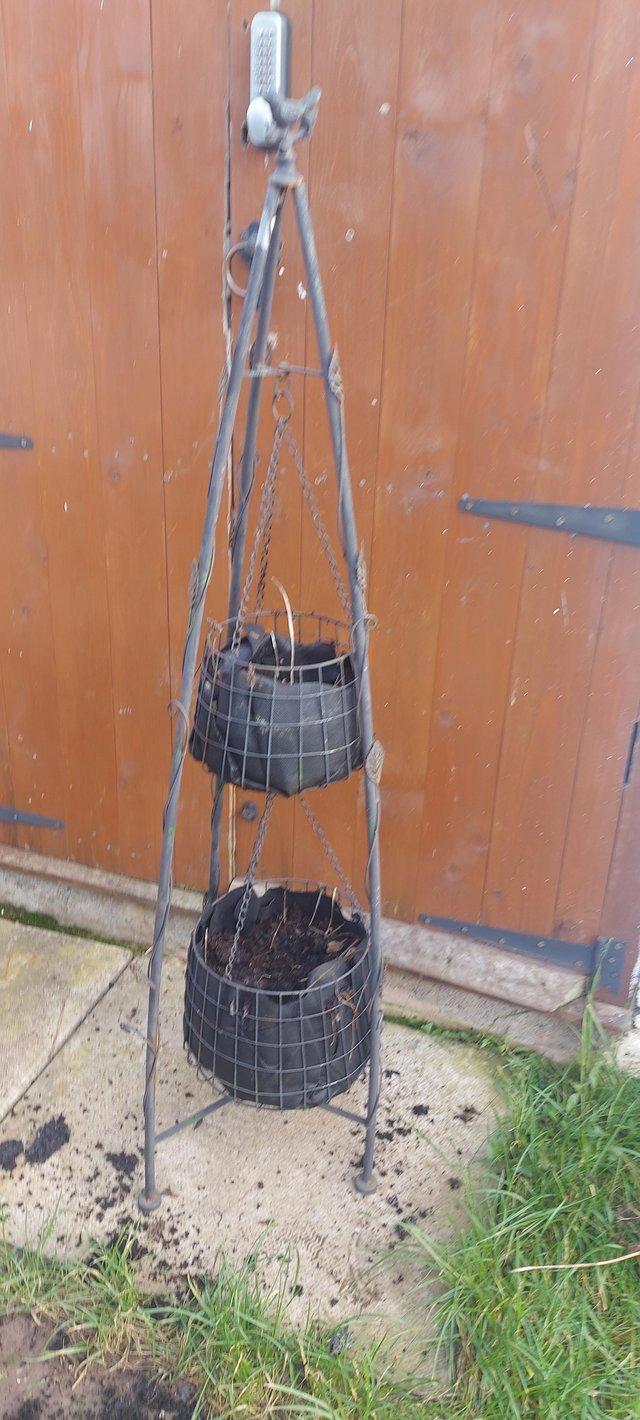 Preview of the first image of Unusual hanging basket plant stand holds 2.