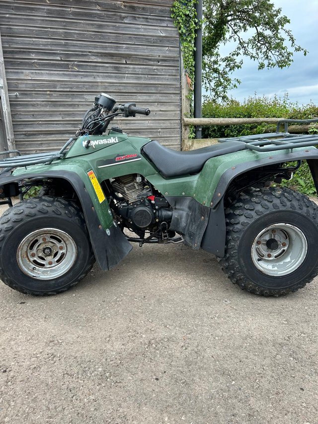 Preview of the first image of KAWASAKI KLF300 QUAD BIKE (AND TRAILER).