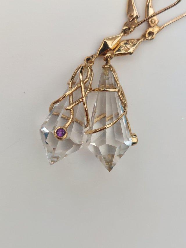 Preview of the first image of Urine Geller rock crystal and gold earrings.