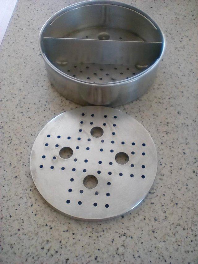 Preview of the first image of Pressure Cooker Basket With divider and also a Trivet.